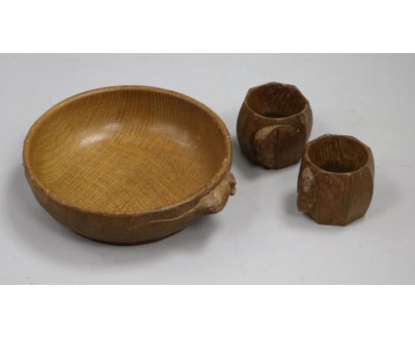 A Robert Thompson (Mouseman) carved oak bowl and a pair of matching serviette rings (3)