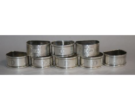 A set of six 1940's silver napkin rings and a pair of engine turned napkin rings.