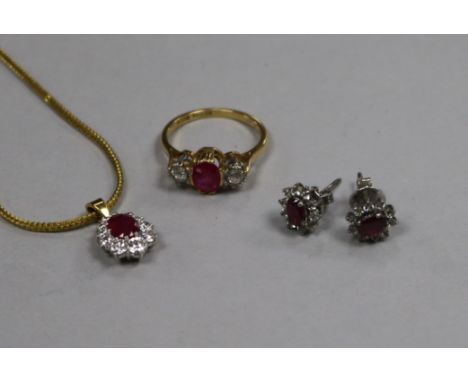 An 18ct gold and platinum ruby and diamond three stone ring, a ruby and diamond cluster pendant on a 9ct gold chain and a pai