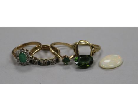 An unmounted oval white opal, three 9ct gem set rings and a 14ct gold ring with loose stone.