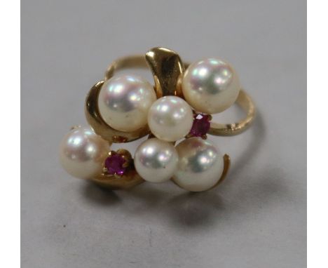 A 14k gold, cultured pearl and ruby cluster dress ring size J.