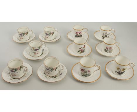 Two sets of coffee cans and saucers -
1. a set of six Royal Worcester pattern 2791, wild flowers
2. a set of five Coalport 'P