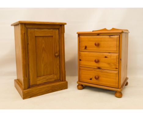 Two modern bedside tables - one in light oak with a single panelled cupboard door (LWH 45.5 x 38.5 x 68cm); the other pine wi