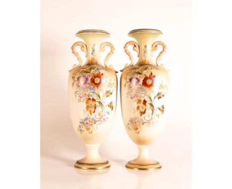 Carltonware Ivory Blushware twin handled Baluster vases in the Ragged Robin pattern with gilt bands to base and rim. Height 3