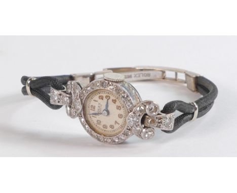 Rolex Geneve ladies diamond encrusted Art Deco cocktail watch in platinum case.  In ticking order, winds, sets and runs. Case