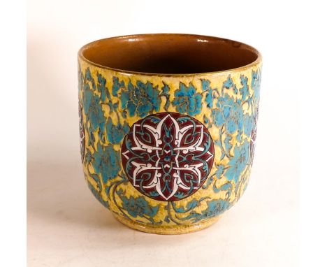 Clement Massier jardinière decorated with turquoise leaves on a yellow ground with four roundels with eastern style enamel de