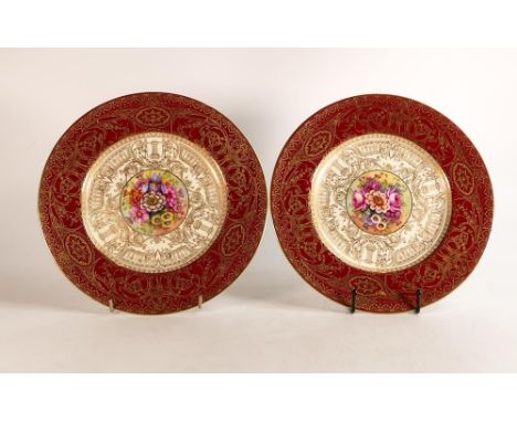 Royal Worcester hand painted cabinet plates. Painted with floral sprays by E. Barker. Borders decorated with raised gilt Neoc