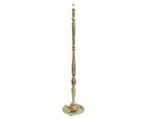 An early 20th century Chinoiserie standard lamp decorated with figures &amp; foliage, on a green ground, height including fit