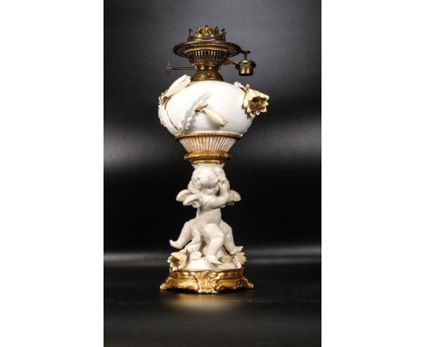 Late 19th century Moore &amp; Co Putti figure group lamp base, impressed marks to base 652, height 32cm inc. fitting - wing t