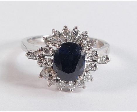 18ct gold sapphire &amp; diamond cluster ring, size N/O, main stone 8mm x 6mm, stamped 18k &amp; tested as such weight 4.51g 