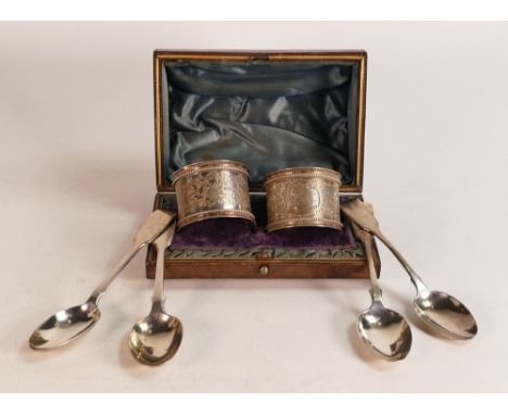 Pair of cased heavy silver napkin rings (with light initials), together with 4 odd silver tea spoons. (6) 
