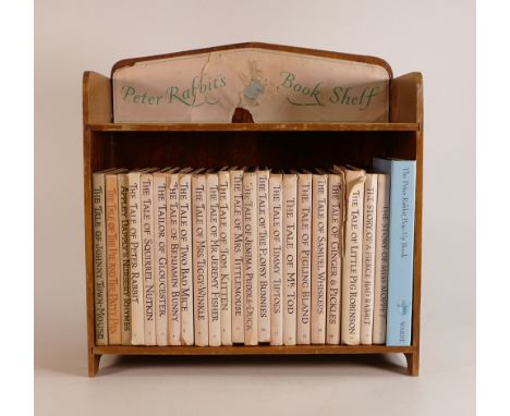 Peter Rabbit book shelf with 23 various edition books (24) 