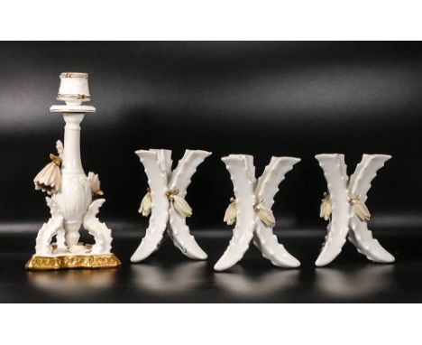 Four late 19th century Moore &amp; Co &amp; similar porcelain spill vases &amp; candlestick, with encrusted flowering foliage