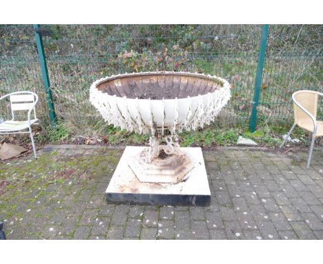 Very large metal ornamental and architectural garden urn and cast iron base in the Arts and Crafts manner.  This item matches