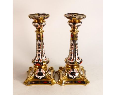 A pair of Royal Crown Derby Imari 1128 pattern candlestick holders, 27cm in height (2). 