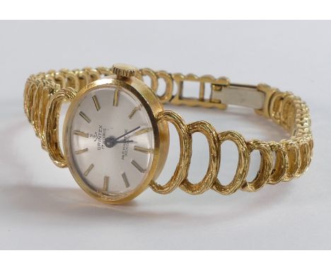 Grintex 18ct hallmarked gold wrist watch and heavy 18ct gold integral bracelet. Dial indicates 17 rubies, antimagnetic, Incab