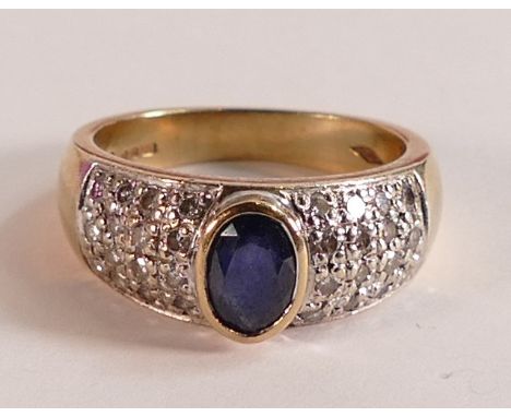 9ct gold ladies ring set with oval blue stone and diamond cluster shoulders, ring size O, 6.1g. 