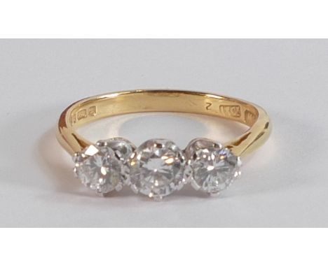 18ct gold three stone diamond ring, good lively diamonds, centre stone approx. .35ct, and two others approx. .25ct, ring size