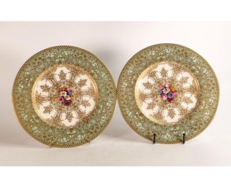 Royal Worcester hand painted cabinet plates. Painted with floral sprays by E. Phillips. Borders decorated with raised gilt Ar