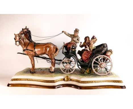 Capodimonte sculpture of a carriage drawn by two horses, with driver, courting couple and a young boy at the rear, signed B M