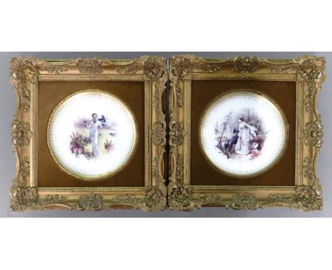 A pair of Minton gilded cabinet plates, each decorated with ladies in period costume by A Boullemier, d.23.5cm, mounted in or