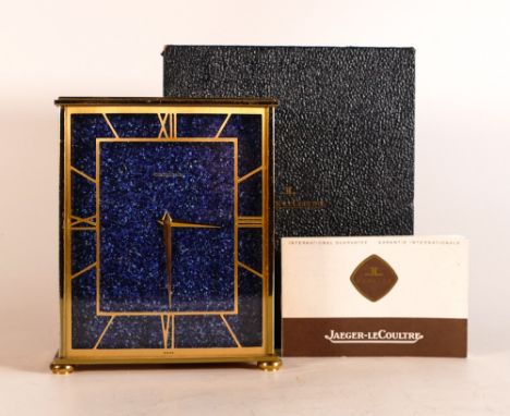 Jaeger LeCoultre brass cased 8-day Mantle clock with Lapis Lazuli face on four squat bun feet. In fitted original box. Height