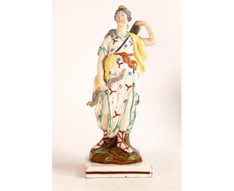 Early 19th century Pearlware figure of Diana of the Hunt. Modelled with bow in hand and reaching for her quiver. Painted in o