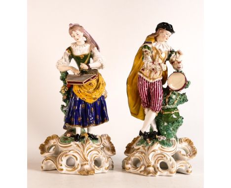 Pair of 19th century English porcelain musician figures on Rococo bases. Male figure playing a percussion instrument, female 