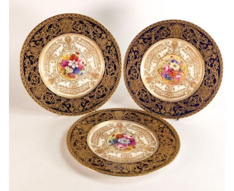 Royal Worcester hand painted cabinet plates. central floral spray reserves by H. H. Price and one by E. Phillips. Border is p