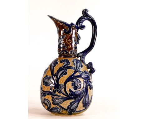 Frank Arthur Butler for Doulton Lambeth, a Stoneware ewer, decorated with scrolling foliage on light &amp; dark brown ground,