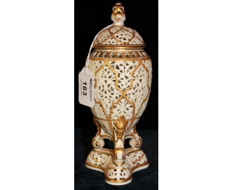 Royal China Works Worcester pierced porcelain pot pourri vase and cover raised on three mask and scroll supports above a pier