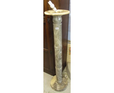 Heavy veined marble standard lamp on circular stepped base.