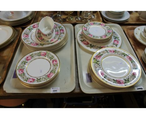 Two trays of Royal Worcester fine bone china gilt and rose design items to include various plates, cake stand, gravy boat etc