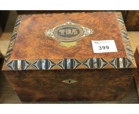 Victorian burr walnut geometrically banded tea caddy with two compartments to the interior.