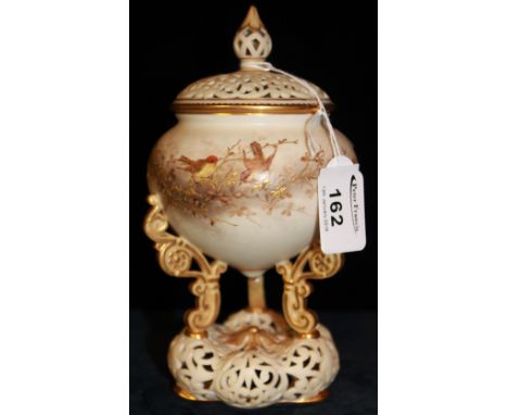 Royal China Works Worcester porcelain pot pourri jar and cover raised on three scrolled supports above a pierced base.  Print