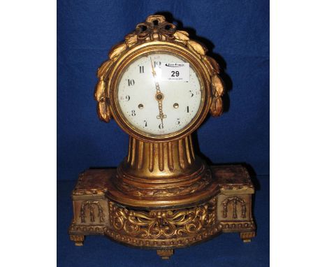 19th Century French gilt wood balloon shaped foliate moulded mantle clock with enamel face and two train brass drum movement 