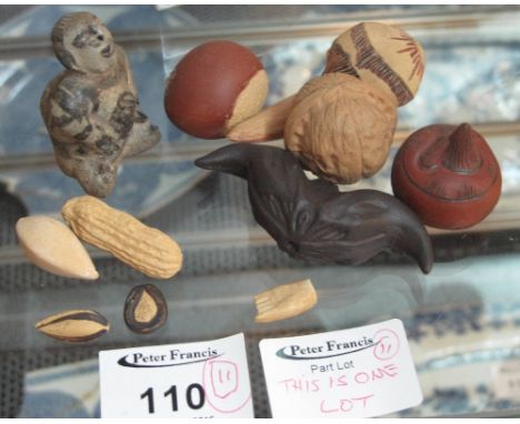 Mixed lot of small Chinese ceramic nuts, seeds and fruit together with a ceramic kneeling figure and a bat shaped ceramic dev