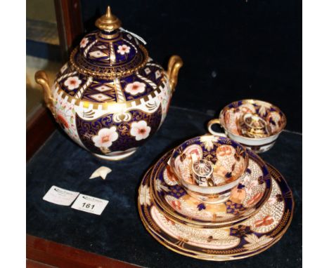 Group of Royal Crown Derby Imari decorated items to include two handled jar and cover, miniature tea pots, cups and saucers, 