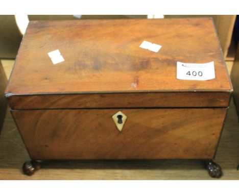 Early 19th Century mahogany tea caddy with bone escutcheon, two compartments to the interior on carved paw feet.