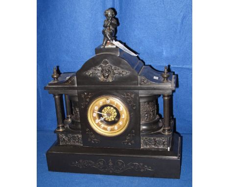 late 19th / early 20th Century black slate architectural two train mantle clock, the case with overall classical and engraved