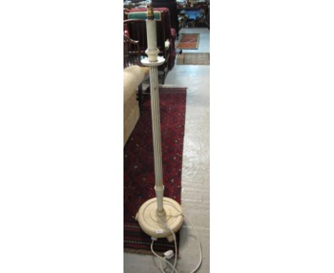 Modern painted standard lamp on circular base.