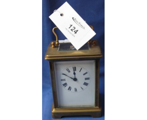 French brass carriage clock with full depth enamel face having Roman numerals.