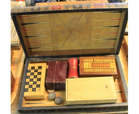 Leather covered, book shaped back gammon board together with cribbage and travelling chess boards, a boxed Staunton chess set