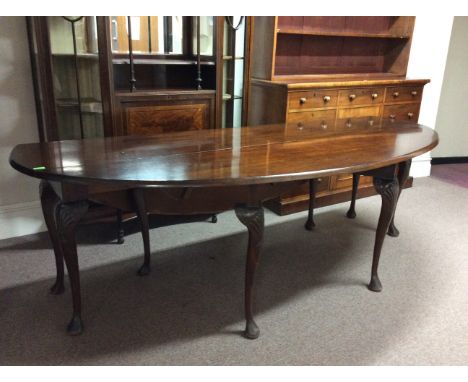 A large Irish mahogany wake table with twin gate cabriole legs.