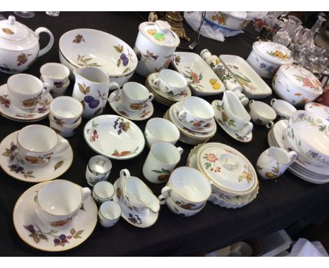 A selection of Royal Worcester teaware, Evesham etc to include teapot, cups, rolling pin, tureens etc.