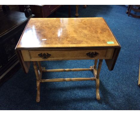 A mini walnut sofa table with single drawer.