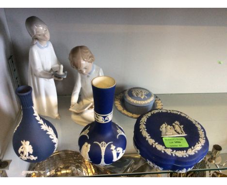 Four Wedgwood items including two vases and two lidded pots, with two lladro figurine.