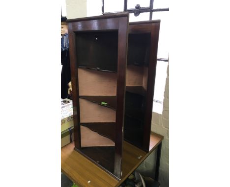 Two early 20th Century mahogany corner shelf units.