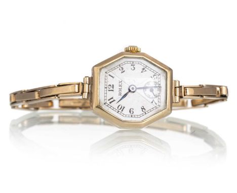 ROLEX NINE CARAT GOLD MANUAL WIND WRIST WATCH,   the octagonal dial with Arabic hour markers, outer railroad seconds track an
