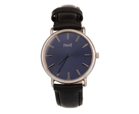 PIAGET EIGHTEEN CARAT WHITE GOLD MANUAL WIND WRIST WATCH,   model 9622, the round blue dial with baton hour markers, 32mm cas